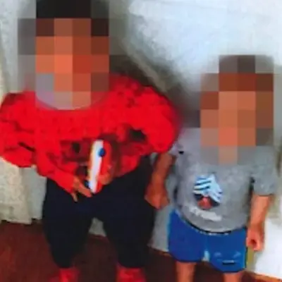 Brothers L.L., left, and J.L., 16 months younger, are seen in an undated photo. Becky Hamber, 46, and Brandy Cooney, 44, are charged in L.L.'s death on Dec. 21, 2022, and have been accused of torturing and confining J.L. Both have pleaded not guilty